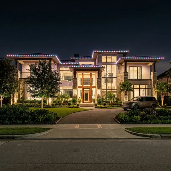 Home with colorful spring roofline lighting